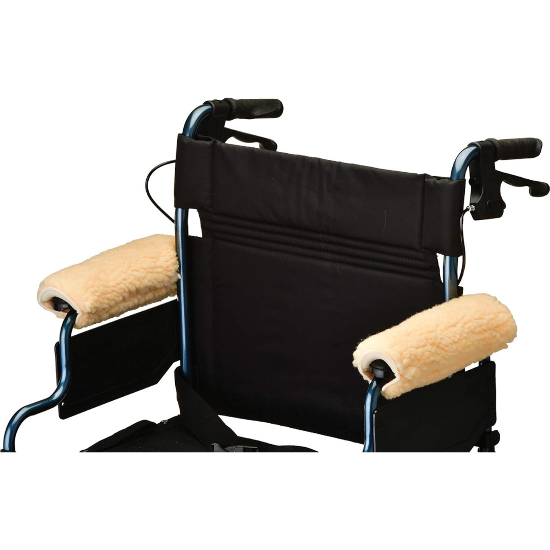 Close-up of the backrest and handles of a wheelchair featuring Nova Sheepskin Fleece Armrest Covers for Wheelchairs & Transport Chairs and a black fabric back support.